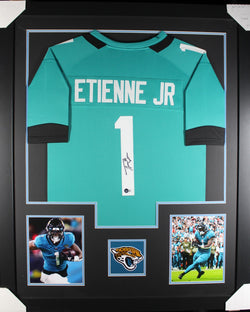 Travis Etienne framed autographed teal jersey "Tower Style"