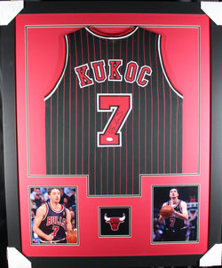 Tony Kukoc framed autographed black pin-stripe jersey