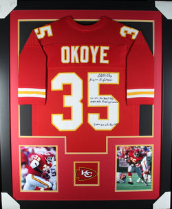 Christian Okoye (4 Inscriptions!!!) framed autographed red jersey