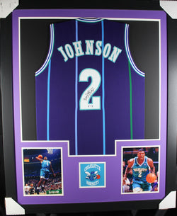 Larry Johnson framed autographed purple jersey